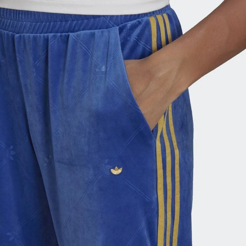 TRACK PANTS IN VELVET WITH EMBOSSED ADIDAS ORIGINALS MONOGRAM AND GOLD STRIPES