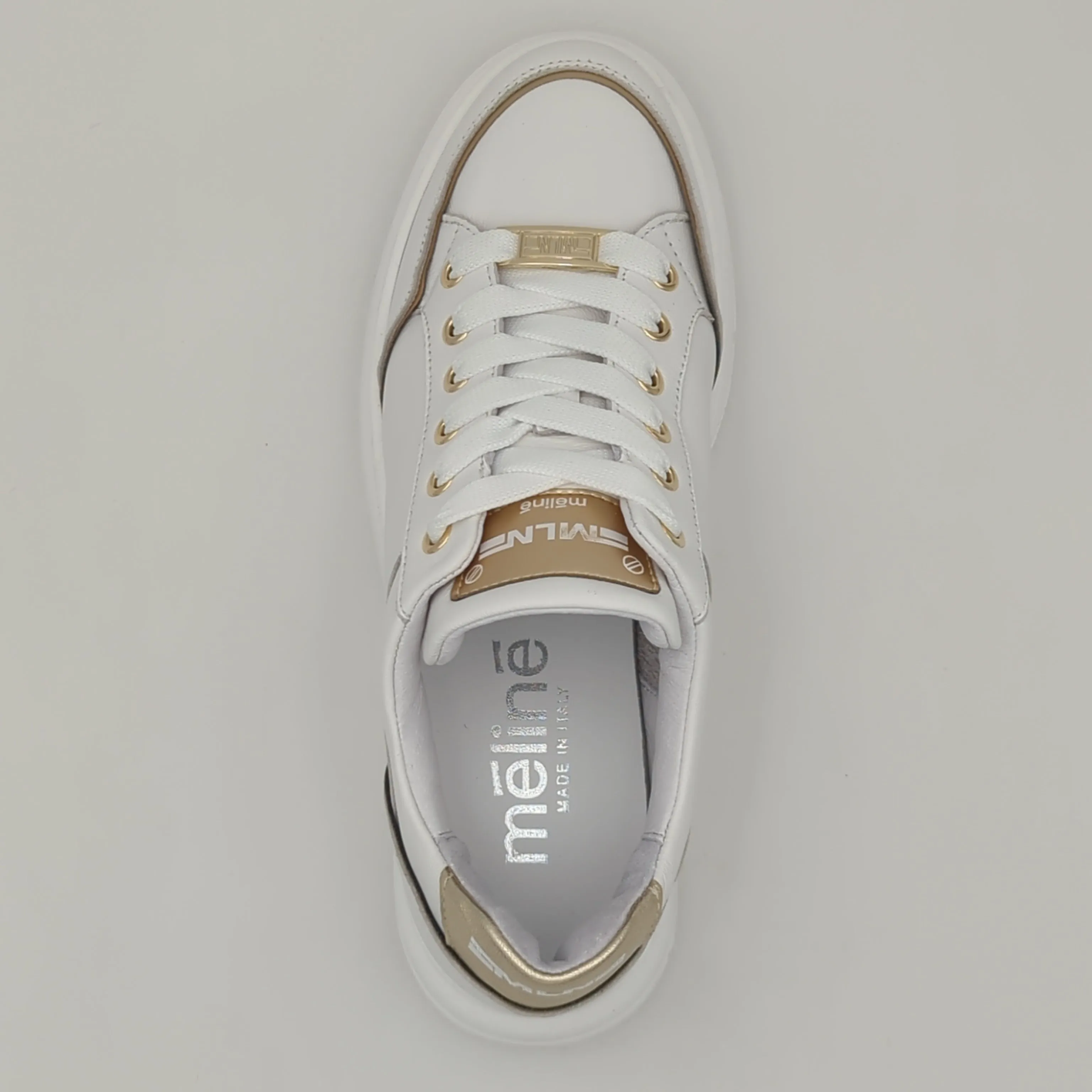 White Trainer with Gold Detailing by Meline