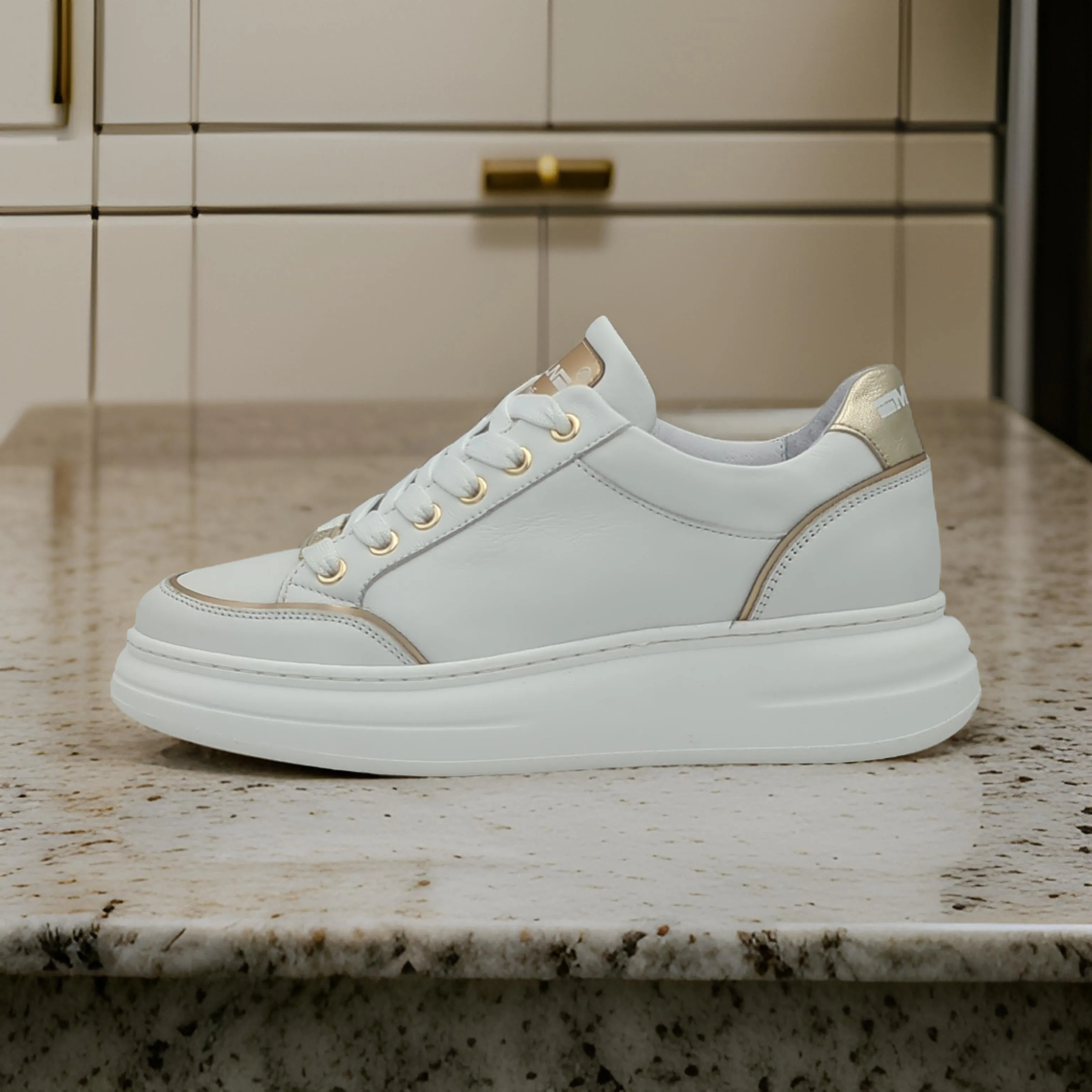 White Trainer with Gold Detailing by Meline