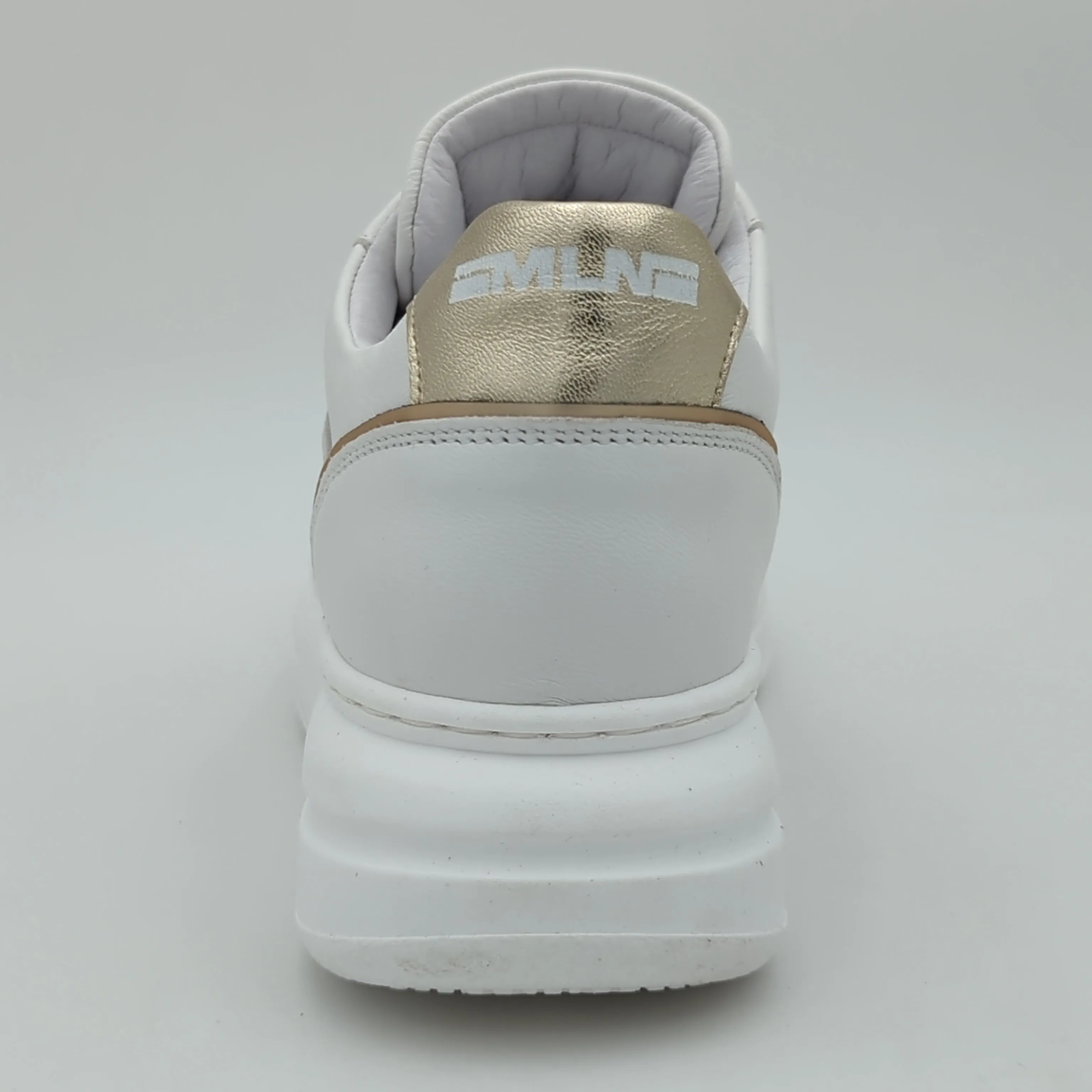 White Trainer with Gold Detailing by Meline